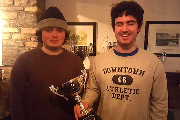 Astrobay league players receive the winner Cup.