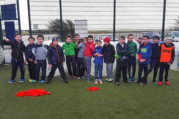 A group of kids at a bubble football birthday party in Astrobay