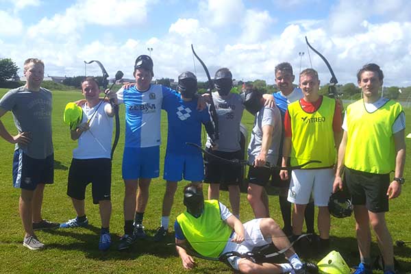 group of tag archery players pose after game