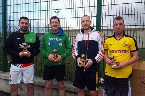 Massive Attack team receiving their trophies for winning last season's Sat 7's League.