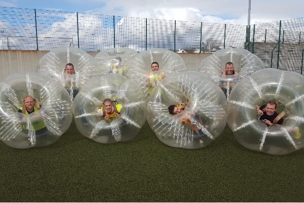 Bubble football group in bubbles pose for team shot!
