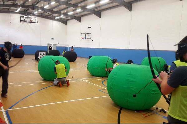 Group of players indoors at Archery game